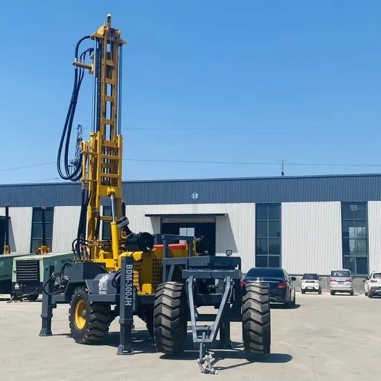 Mobile industrial drilling rig parked outside a warehouse